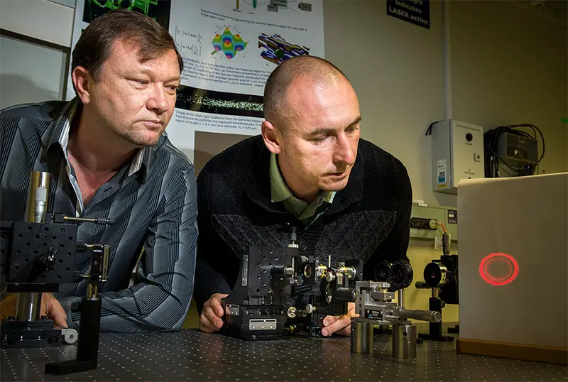 Dr Vladlen Shvedov (L) and Dr Cyril Hnatovsky adjusting the hollow laser beam in their lab at RSPE. Image Stuart Hay, ANU